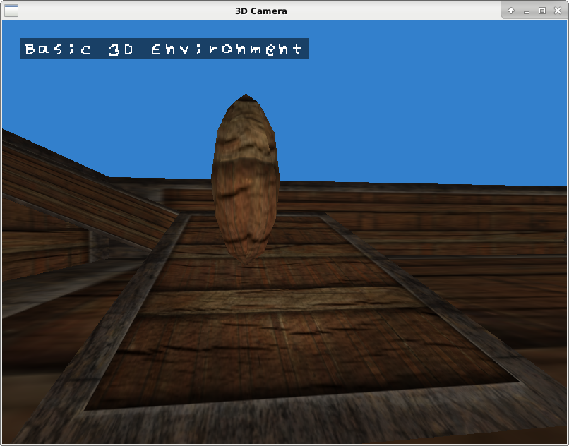 A screenshot of the OpenGL Ball Physics program. It shows a simple, low-poly scene, in which everything has a wooden crate texture. A very tall ellipsoid is sliding down a slope toward the camera. Although the scene is generally dim with a cornflower blue background, the middle of the screen is lit by a flashlight.